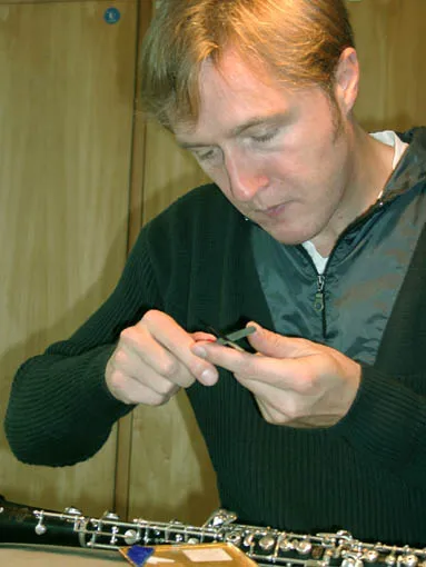 A professional oboist playing the oboe